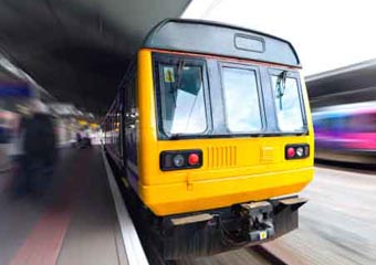 Image of a train pulling into a railway station