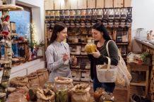 Shop assistant helping a customer in packaging free shop