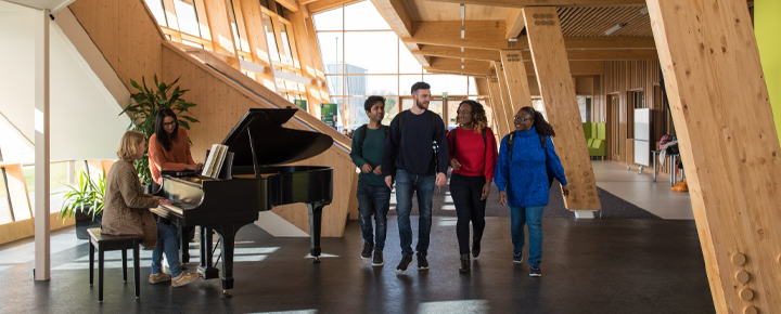 Postgraduate students walking through the GSK Building Jubilee Campus - WEBEDI