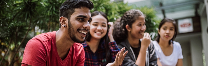 Students chatting and smiling