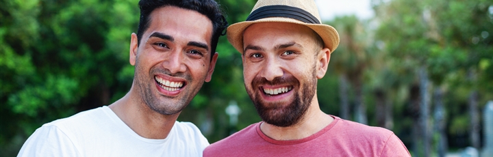 Two men smiling
