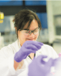 Rachel Gomes wearing safety googles in a lab.