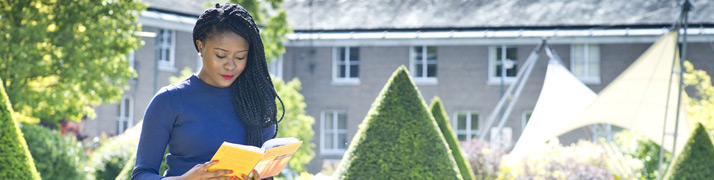 student reading outside the politics building
