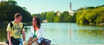 Undergraduate students sat by Highfields Lake, University Park