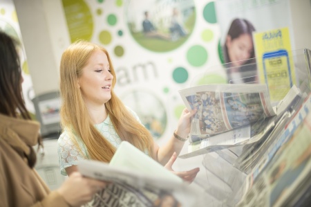 Woman reading newspaper