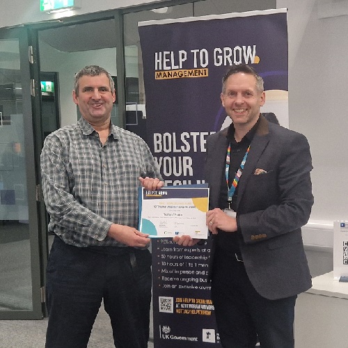 Richard Major receives his completion certificate from Nick Proverbs, Executive Education, during the Help to Grow: Management course.