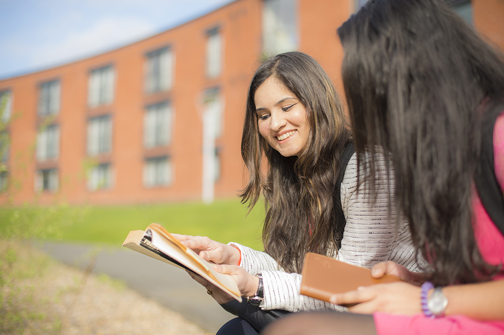 Two female students outside Melton hall Jubilee campus