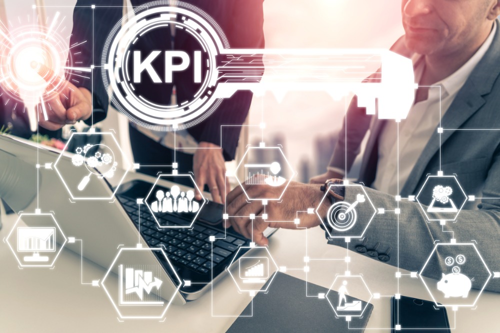 A man on a computing depicting key performance indicator