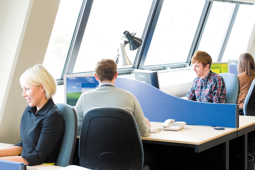 Staff sat at their desks working on Jubilee campus