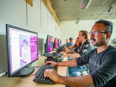Classroom of people on laptops