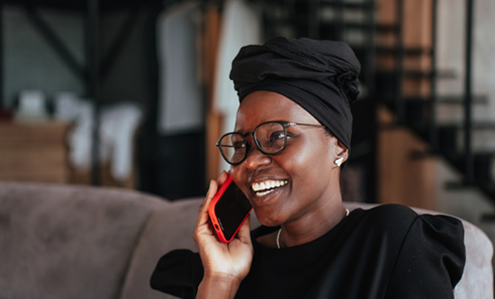 Person with a head covering talking on the phone