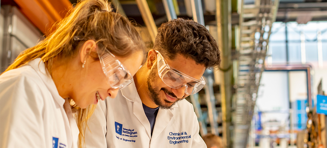 Undergraduate students testing water friction losses across piping