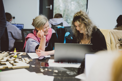 An academic helping an undergraduate students