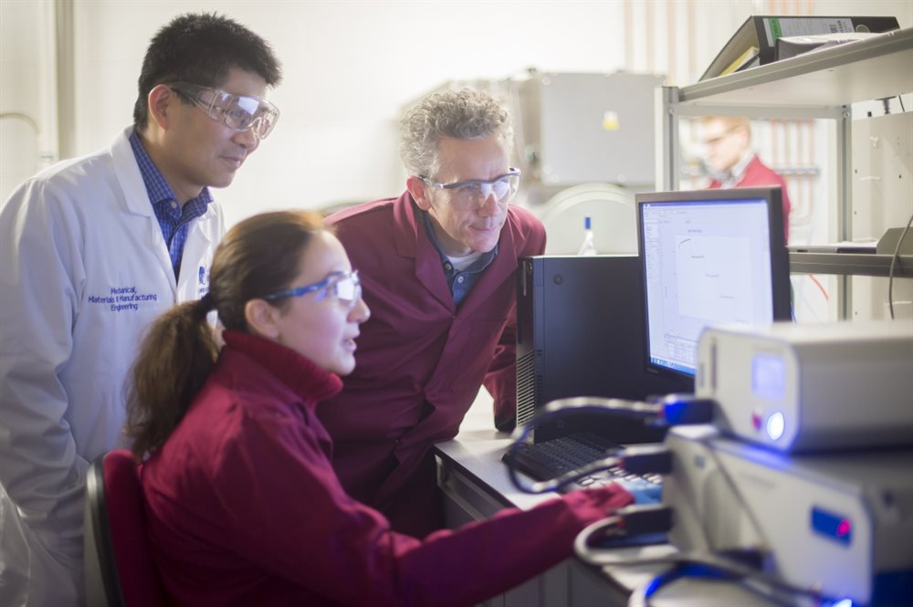 Researchers in a lab looking at results
