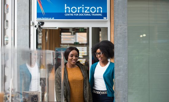 Two students talking in the Horizon CDT space