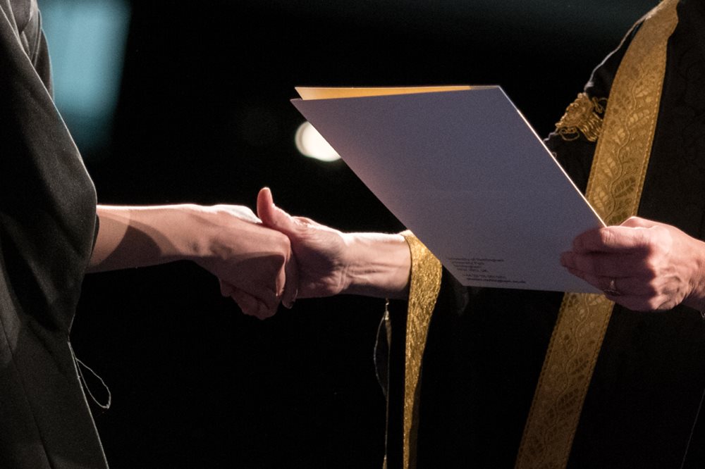 University Vice-Chancellor handing out certificates at Winter Graduation 2017