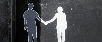 A drawing of two people holding hands