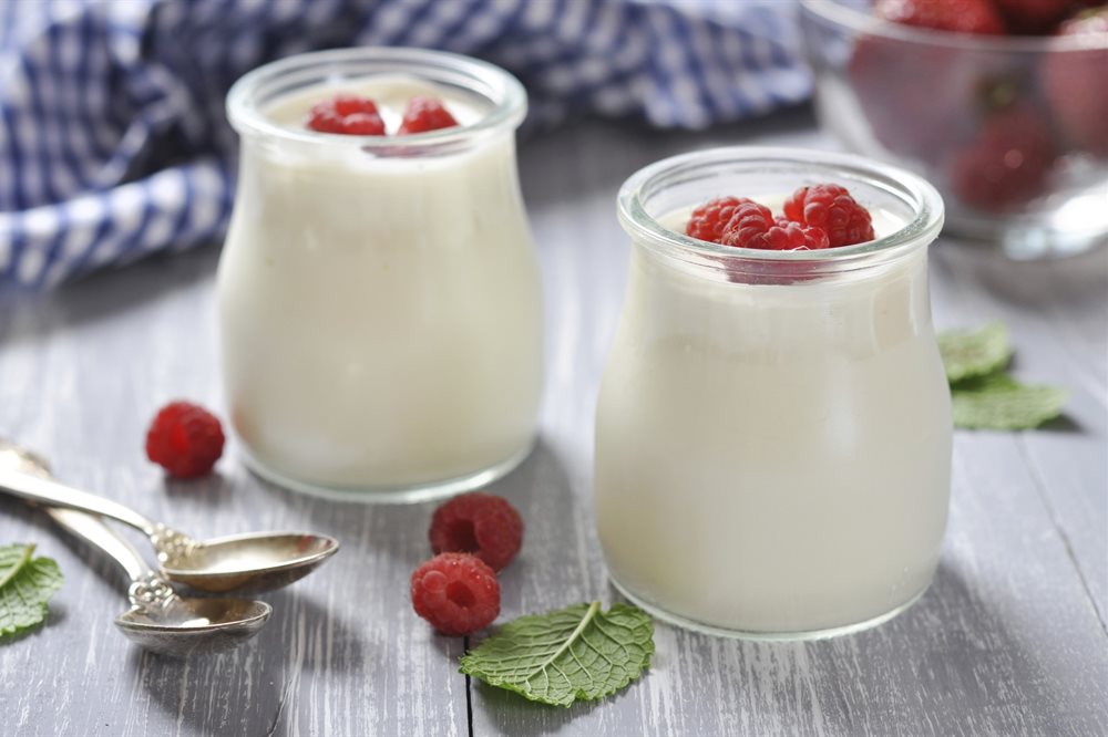 Glass yoghurt pot topped with raspberries