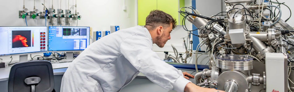 Researcher operating an equipment in the lab